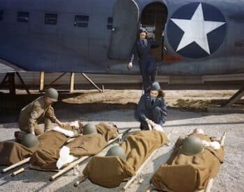 With the aid of a mock-up fuselage of a Douglas C-47 transport, nurses of the Air Evacuation Unit at Bowman Field, Kentucky, work on stretcher cases to be "tansported" to the base hospital
